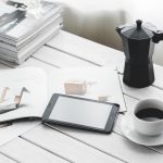 Technology, tablet, coffee cup — The Art of Crowd Management in Karaoke Hosting