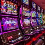 Colorful slot machines lined up in a casino with neon lights and jackpot displays. — The Rise of Live Dealer Casinos